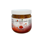 Cubed radish kkakdugi in a glass jar with white lid, traditional Korean radish kimchi
