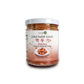 Food Jangter fermented cubed radish kimchi in a jar – traditional Korean side dish, crunchy and mildly spicy