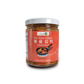 Stir-fried kimchi (bokkeum) in a jar - savory and spicy Korean side dish made with aged kimchi