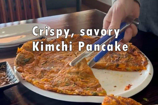 Crispy Kimchi Pancake Recipe served on a plate, cut into slices