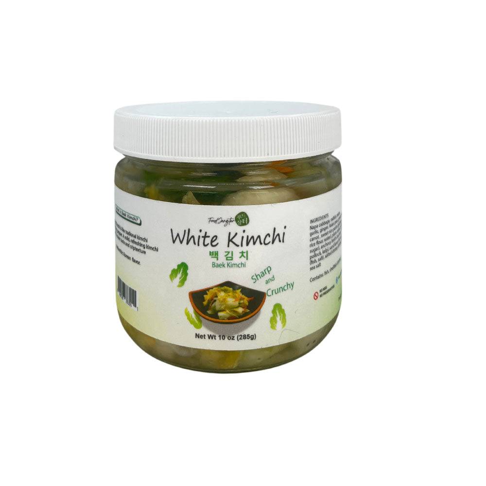 White baek kimchi in a glass jar with white lid, non-spicy Korean kimchi